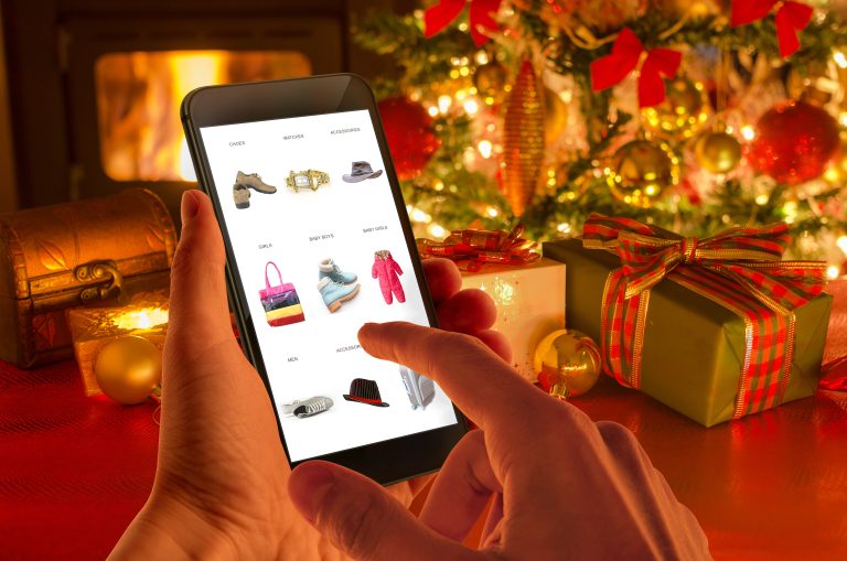 Christmas,Online,Shopping,With,Phone.,Christmas,Tree,,Gifts,,Lights,And