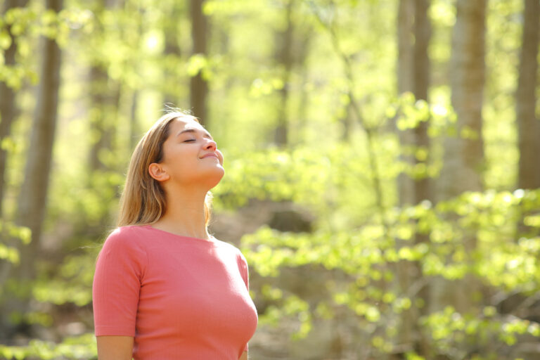 Relaxed,Woman,Breathing,Fresh,Air,In,A,Beauty,Sunny,Forest