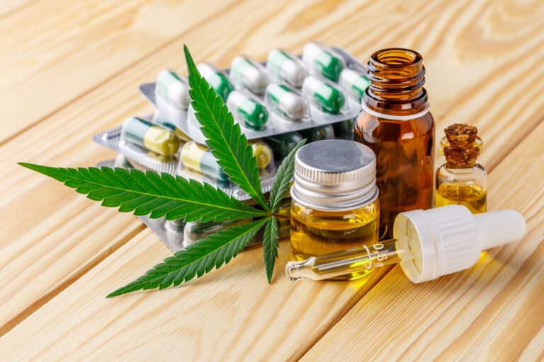 Green,Leaves,Of,Medicinal,Cannabis,With,Extract,Oil.medical,Marijuana,Flower
