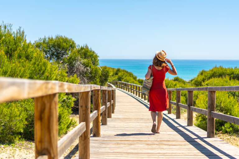 A,Young,Girl,On,The,Wooden,Path,To,Playa,Moncayo