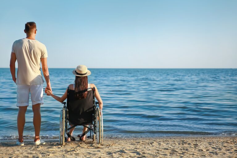 Young,Woman,With,Physical,Disability,And,Her,Boyfriend,At,Sea