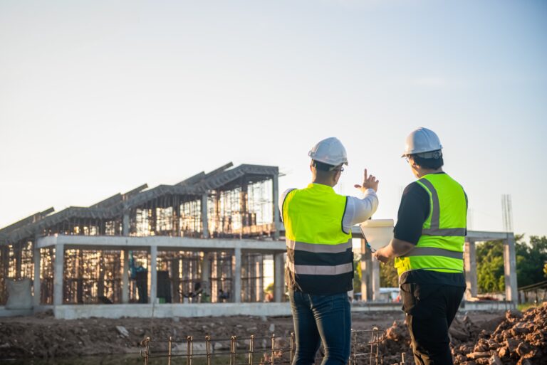 Two,Architect,Man,Discussing,About,The,Building,Plan,And,See