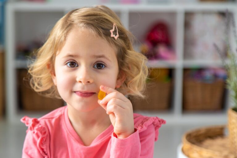 Child,Eating,Jelly,Candies,At,Home.,Selective,Focus.,Food.